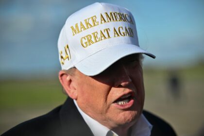 US President Donald Trump speaks to reporters before boarding Air Force One upon departure
