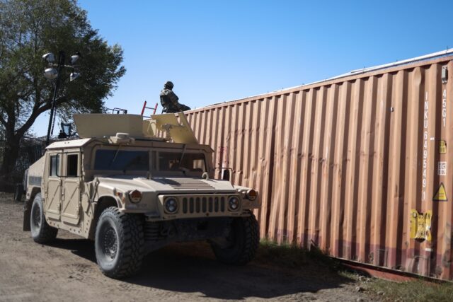 A US soldier monitors the border with Mexico in Eagle Pass, Texas