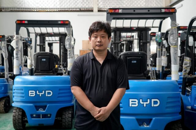 Zhang Chundong, manager at Huochacha New Energy Group, posing for a photo at his factory i