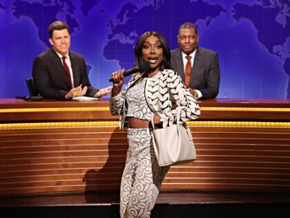 SATURDAY NIGHT LIVE -- Episode 1884 -- Pictured: (l-r) Anchor Colin Jost, Ego Nwodim as Mi