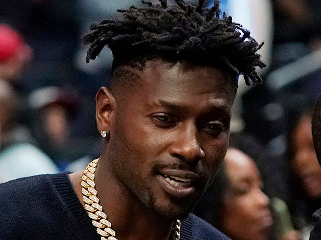 Former NFL player Antonio Brown watches an NBA basketball game between the Los Angeles Cli