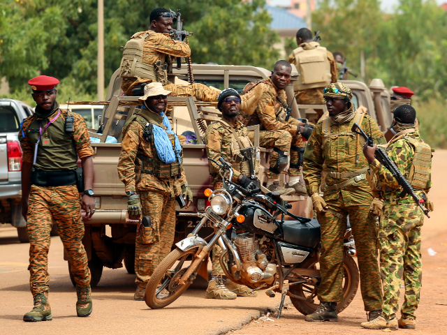 FILE - Soldiers, loyal to Burkina Faso's latest coup leader Capt. Ibrahim Traore, are pict