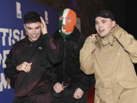 ‘Kneecap’ Irish Rapper Charged Under UK Counter-Terrorism Law Over Hezbollah, Hamas Com