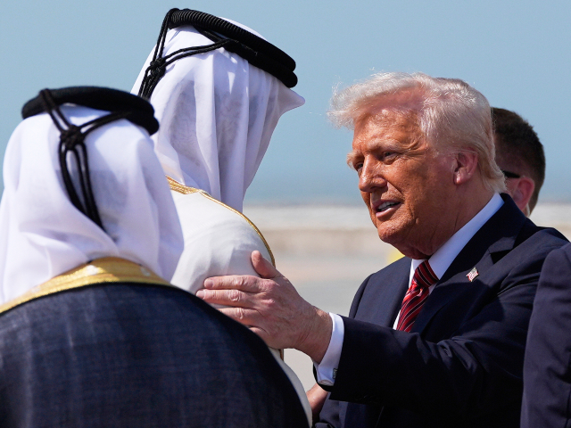 AP25134424910308 President Donald Trump is greeted by Qatar's Emir Sheikh Tamim bin Hamad Al Thani as he ar