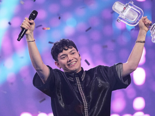 Winner of the Eurovision Song Contest JJ from Austria holds up the trophy onstage, he won