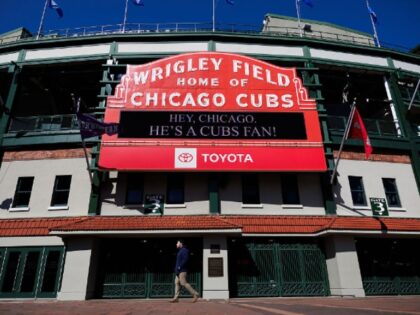 “Hey, Chicago. He’s a Cubs fan!” reads the Wrigley Field marquee in Chicago on May 8