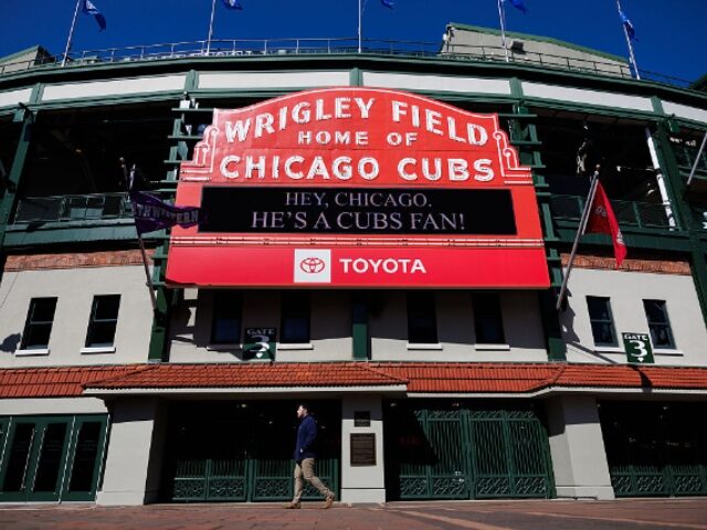 “Hey, Chicago. He’s a Cubs fan!” reads the Wrigley Field marquee in Chicago on May 8