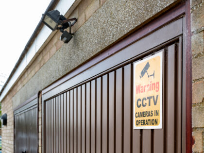 CCTV sign on garage door