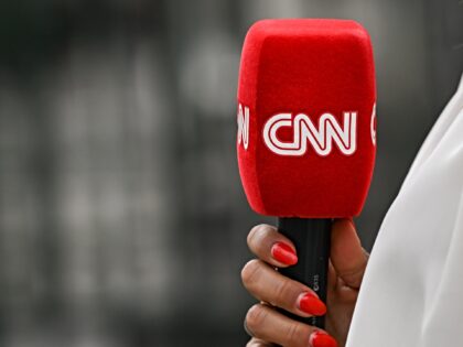 PARIS, FRANCE - JULY 08: CNN microphone held by a reporter outside the entrance gate to th
