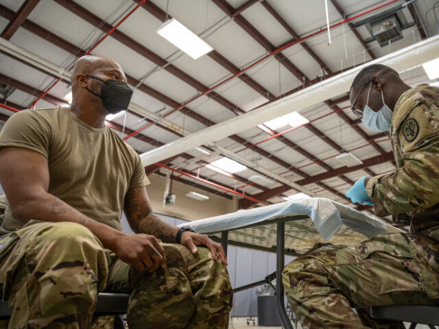 COVID vaccinations for military Preventative Medicine Services NCOIC Sergeant First Class Demetrius Roberson prepares to a