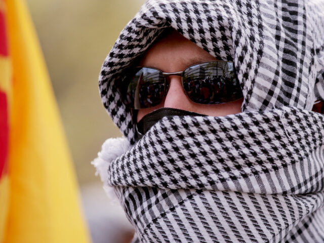 Clumbia University Pro-Palestinian Protest Pro-Palestinian protesters wear keffiyehs as they march from City College to Columbia Univ