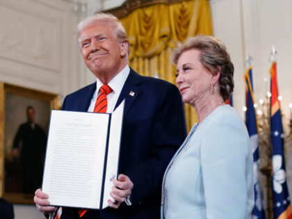 US President Donald Trump, left, and Linda McMahon, US education secretary, after signing