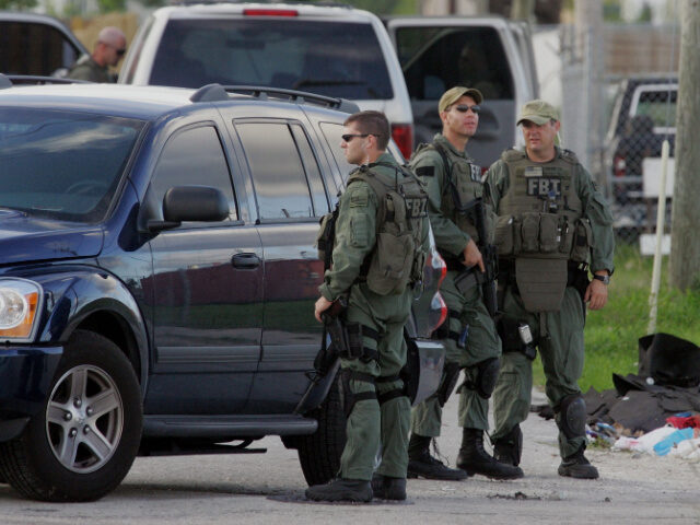 FBI agents conduct what is being reported as a terrorism-related investigation near the Sc