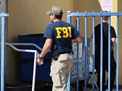 MIAMI - OCTOBER 21: An agent with the F.B.I. is seen outside the American Therapeutic Corp