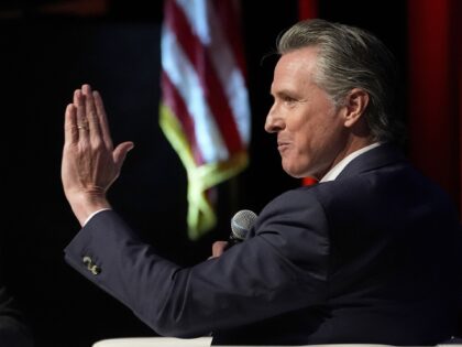 California Gov. Gavin Newsom, right, holds a fireside chat with Stephen Cheung, the Presid