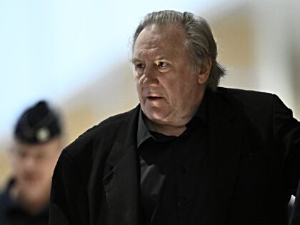 French actor Gerard Depardieu arrives for his trial in which he is charged with sexually a