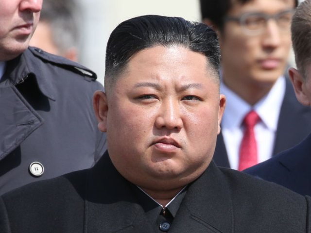 Kim Jong Un, North Korea's leader, watches an honor guard before his departure to North Ko