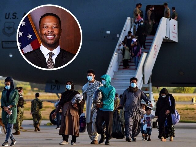 SPAIN-US-AFGHANISTAN-CONFLICT-EVACUATION Refugees disembark from a US air force aircraft after an evacuation flight from Kabul at t