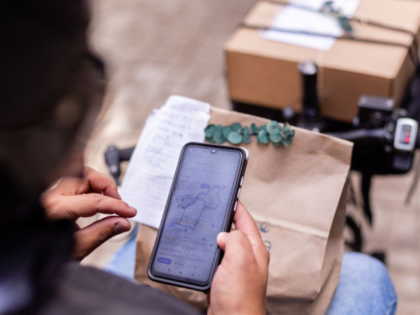 MEDELLIN, COLOMBIA - OCTOBER 30: Wilson Guzman works as delivery man carries a package to
