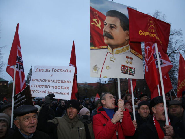 MOSCOW, RUSSIA - NOVEMBER 7 (RUSSIA OUT) Russian Communits Party supporters with Soviet fl