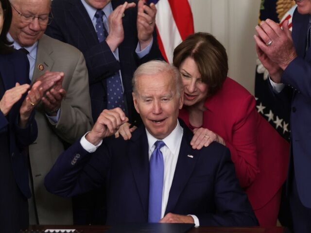 GettyImages-1403329431-2 WASHINGTON, DC - JUNE 16: U.S. Sen. Amy Klobuchar (D-MN) gives President Joe Biden a hug a