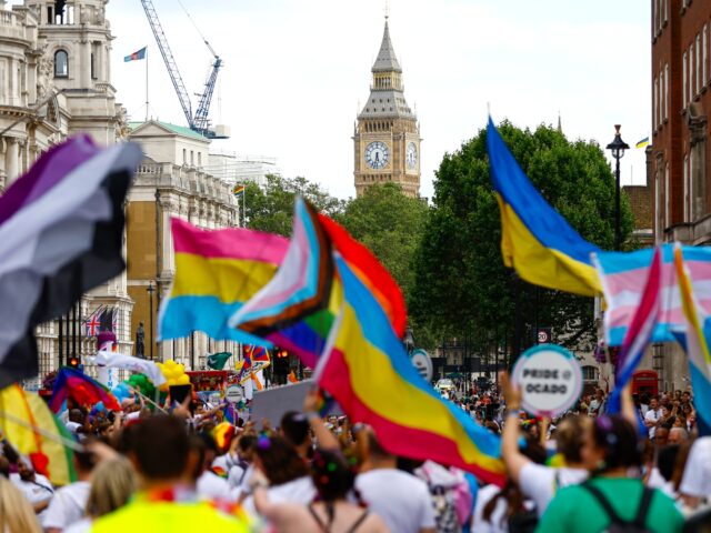 LONDON, ENGLAND - JULY 01: Revellers carry flags during the Gay Pride Parade on July 01, 2