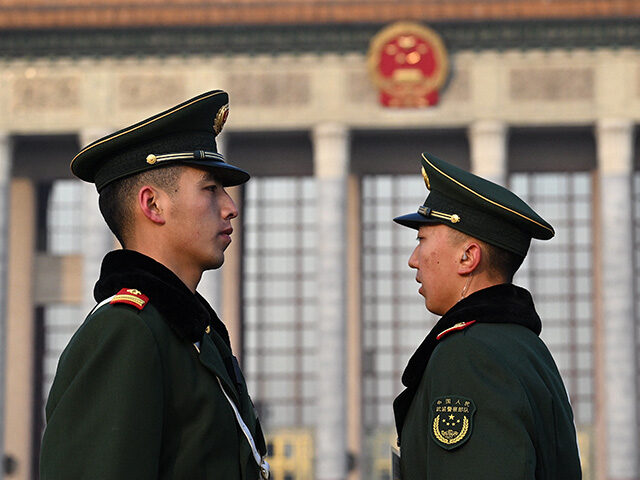 Paramilitary police stand guard ahead of the second plenary session of the Chinese People'