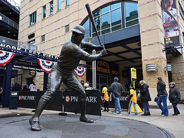 Fans enter the ballpark past the Willie Stargell statue before the Pittsburgh Pirates home