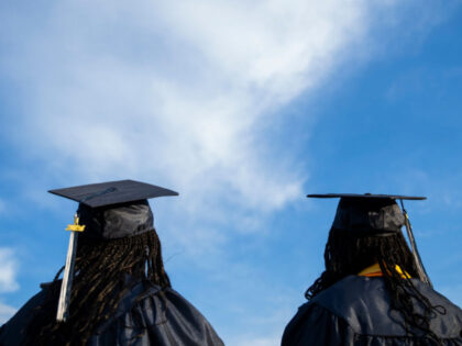 Medford, MA - June 5: Identical twins, Eleanor and Oprah Nkera graduate Medford High Schoo