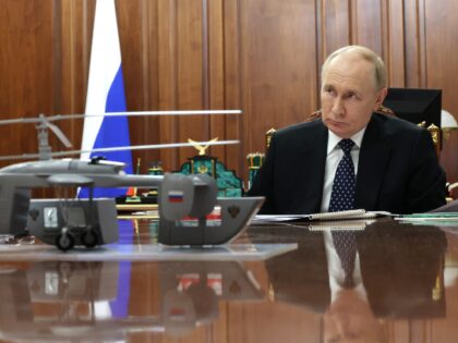 In this pool photograph distributed by Russian state agency Sputnik, Russia's President Vl