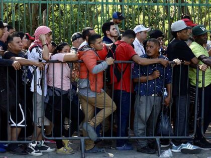 Migrants wait to be processed by the Mexican refugee commission, following the cancellatio
