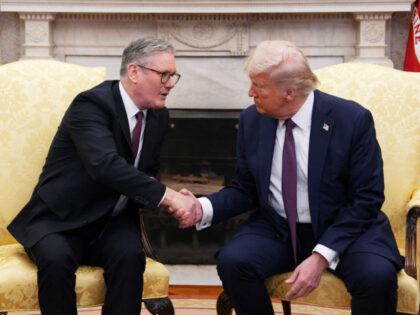 US President Donald Trump shakes hands with British Prime Minister Keir Starmer during a m