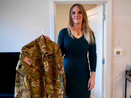 Jo Ellis holds one of her firearms in her apartment in Richmond, Virginia, on February 12,
