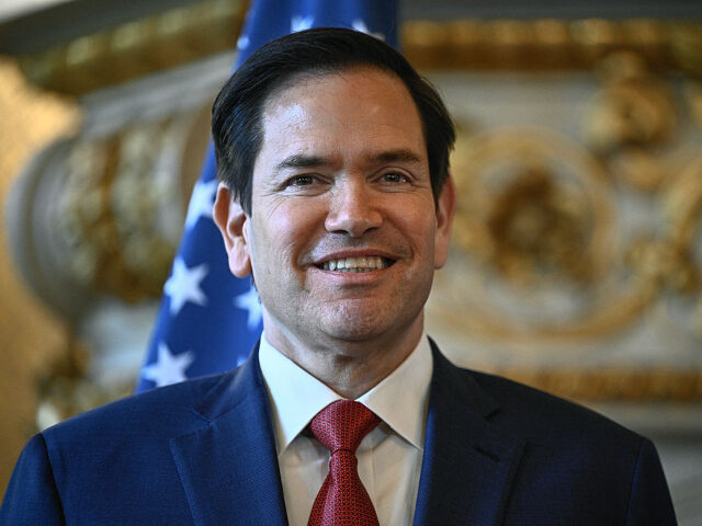 US Secretary of State Marco Rubio poses for photos upon his arrival at the Quai d'Ors