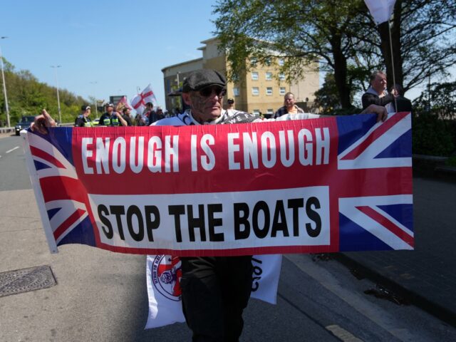 Protesters gather ahead of an anti-immigration protest march in Dover on the south-east co