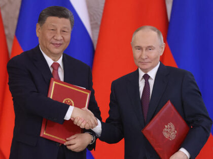 MOSCOW, RUSSIA - MAY 8 (RUSSIA OUT) Russian President Vladimir Putin (R) exchanges documen