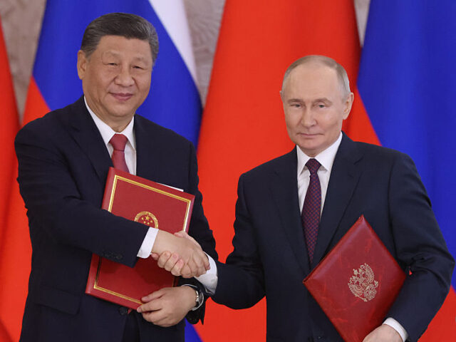 MOSCOW, RUSSIA - MAY 8 (RUSSIA OUT) Russian President Vladimir Putin (R) exchanges documen