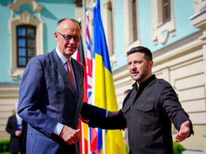 10 May 2025, Ukraine, Kiew: Federal Chancellor Friedrich Merz (l, CDU) is received by Volo