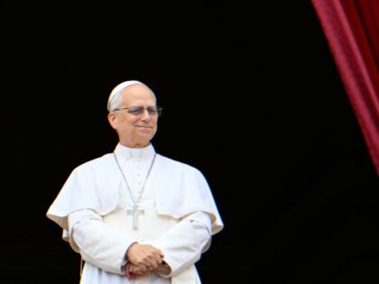 Pope Leo XIV greets the crowd after the Regina Caeli prayer from the main central loggia b