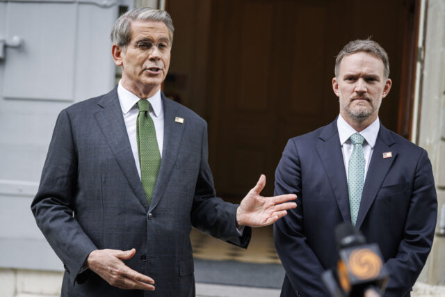 SWITZERLAND-US-CHINA-TRADE-TARIFF US Treasury Secretary Scott Bessent (L) and US Trade Representative Jamieson Greer speak t