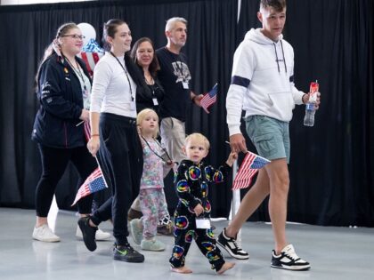The first group of Afrikaners from South Africa to arrive for resettlement listen to remar