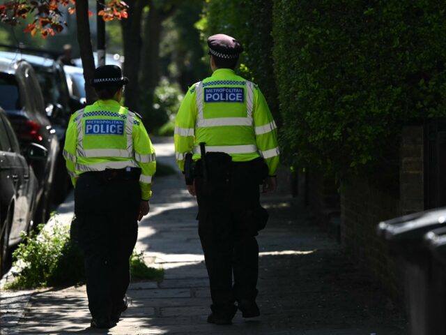 Police officers patrol outside the home of British Prime Minister Keir Starmer in London o