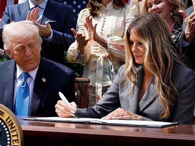 First lady Melania Trump signs the TAKE IT DOWN Act alongside U.S. President Donald Trump,