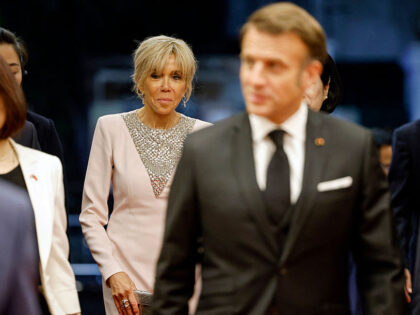 Brigitte Macron (back C), the wife of France's President Emmanuel Macron (C) attends