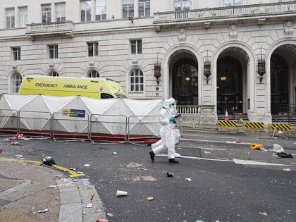 Forensic officers at the scene in Water Street near the Liver Building in Liverpool after