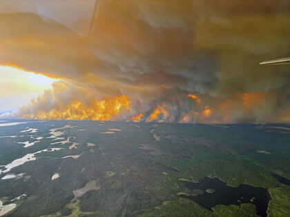 Smoke rises from wildfire in Flin Flon, Manitoba, Canada May 27, 2025. A wildfire emergenc