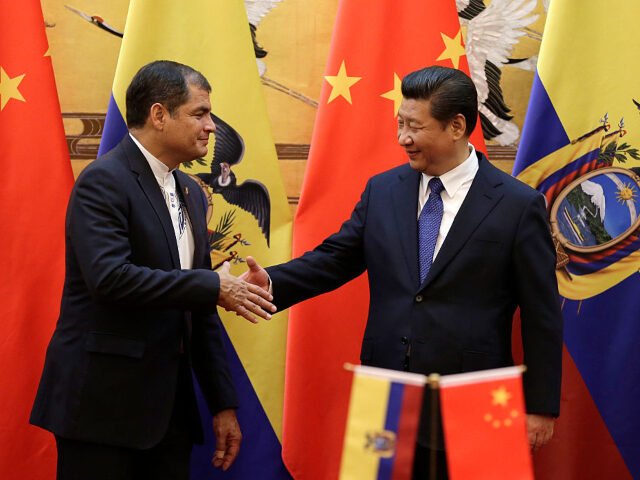 BEIJING, CHINA - JANUARY 7: Chinese President Xi Jinping, right, shakes hand with Ecuador&