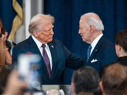 WASHINGTON, DC - JANUARY 20: U.S. President-elect Donald Trump shakes hands with U.S. Pres