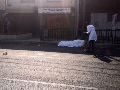 Mexico City investigators document the killing of two top officials. (Credit Breitbart New