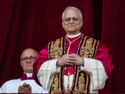 Pope Leo XIV greets the crowd from St. Peter's Basilica after being elected by the co